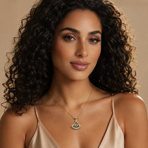 Gold fan-frame necklace styled in an elegant jewellery flat lay