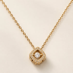 Angled view of the gold floating crystal halo necklace