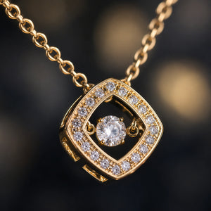 Gold floating crystal halo necklace on a dark jewellery studio display