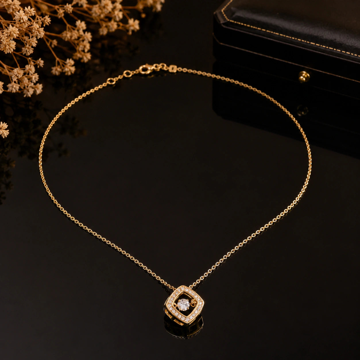 Gold floating crystal necklace styled in an elegant jewellery flat lay