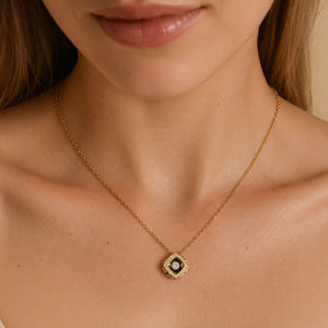 Close-up of the floating crystal and gold halo pendant detailing