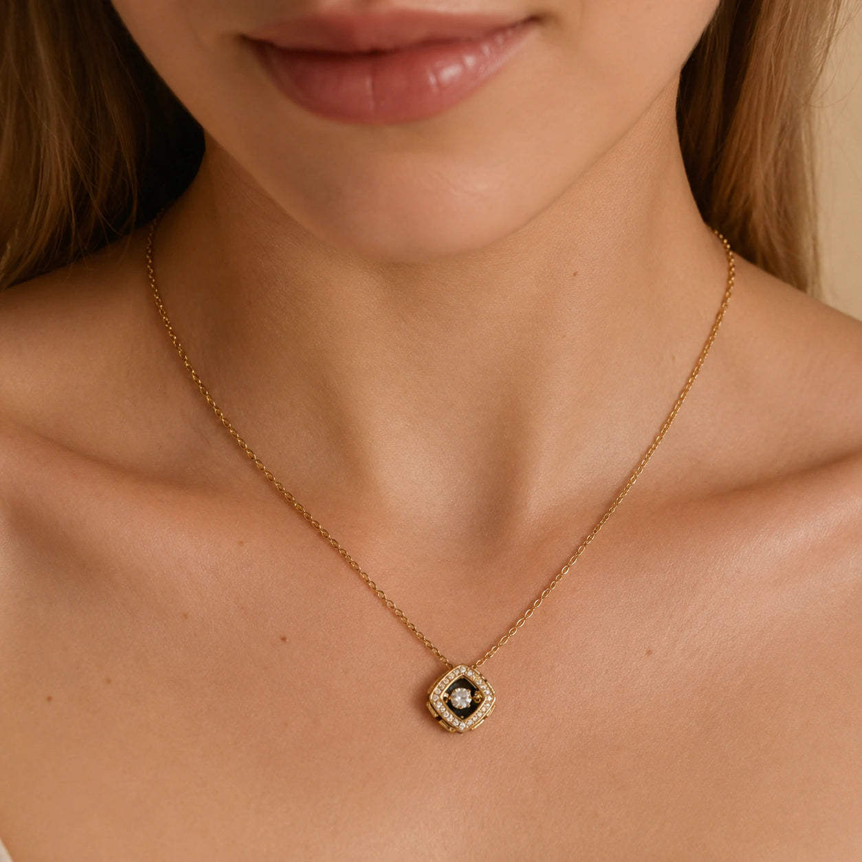 Close-up of the floating crystal and gold halo pendant detailing