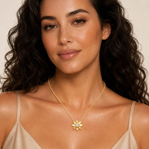 Angled view of the gold floral crystal stone-chain necklace