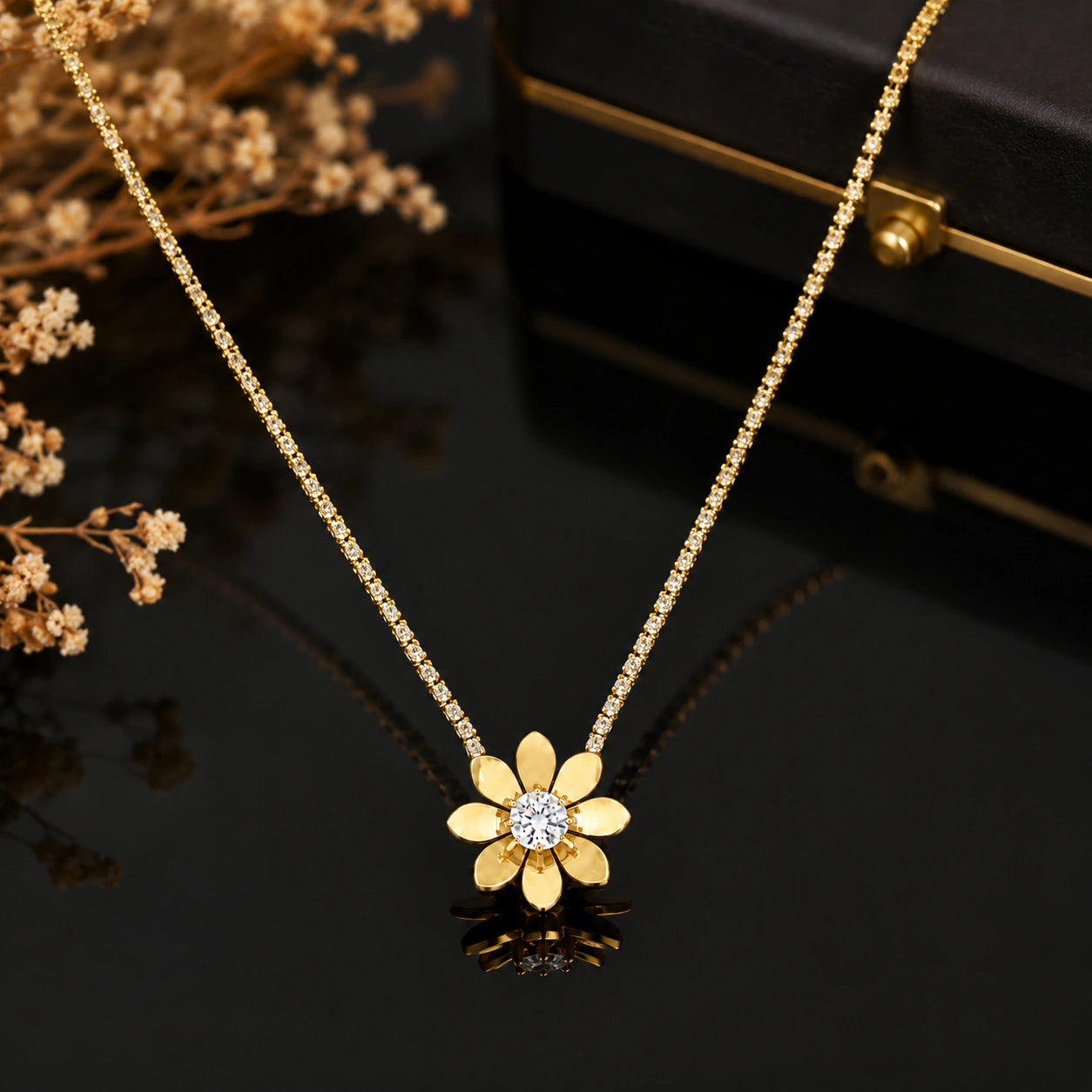 Gold floral stone-chain necklace styled in an elegant jewellery flat lay