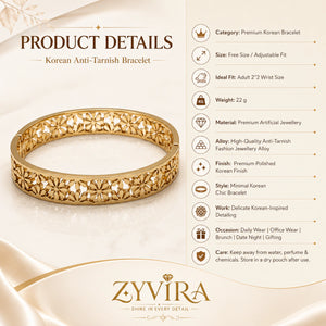 Gold floral openwork kada styled in an elegant jewellery flat lay