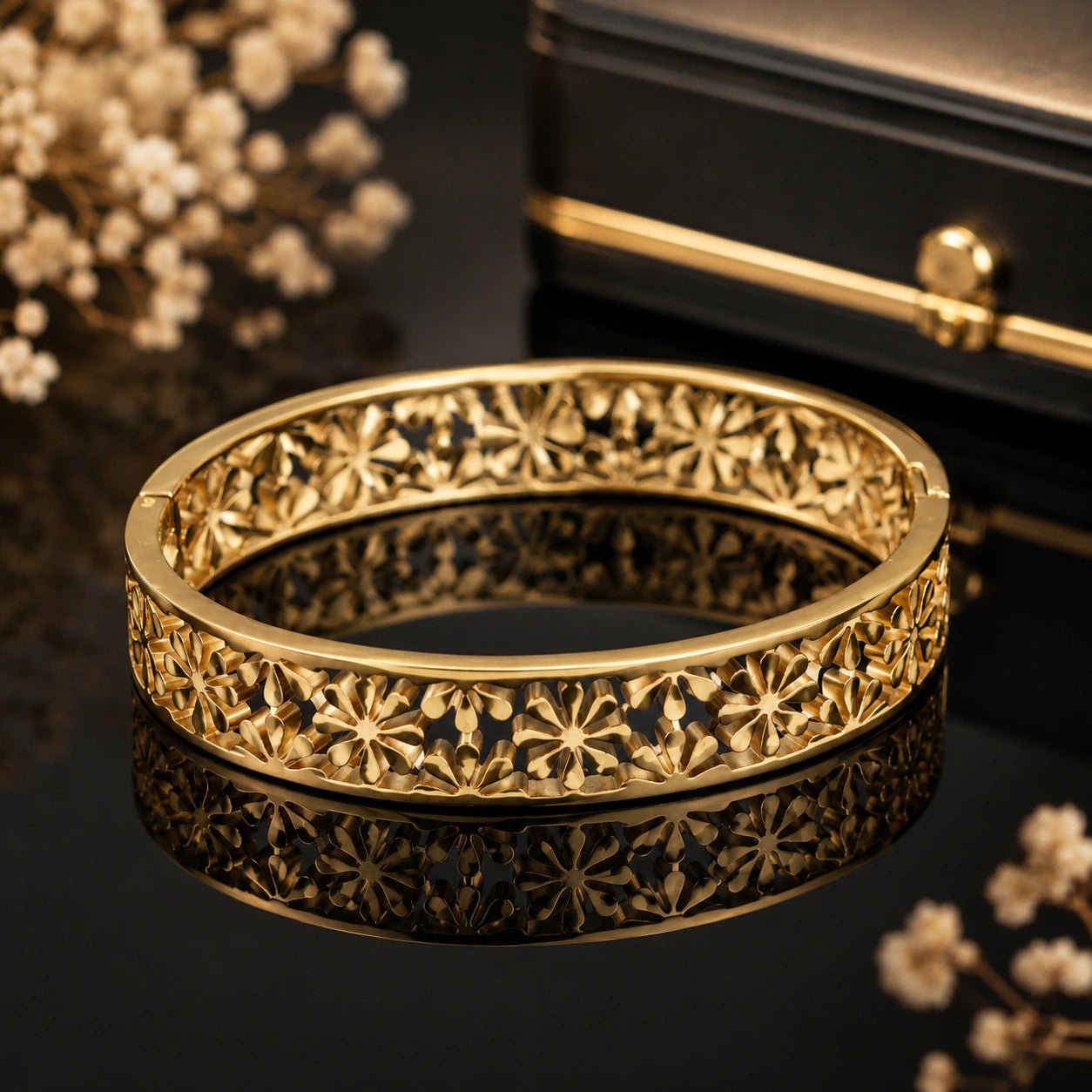 Close-up of floral openwork and hinged kada detailing