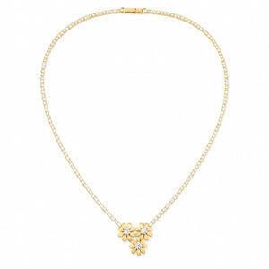 Angled view of the gold floral trio crystal necklace