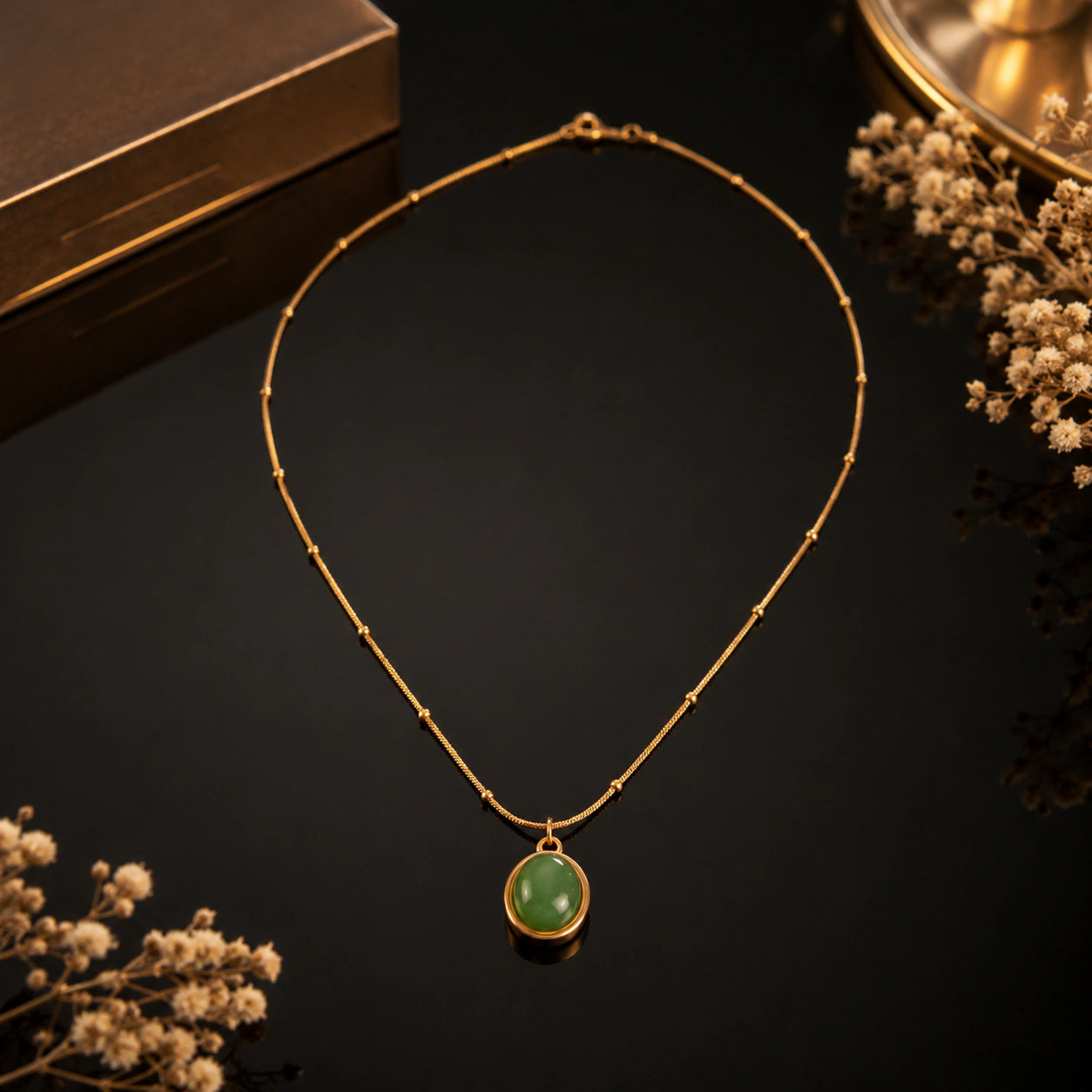 Alternate detail view of the green oval cabochon pendant