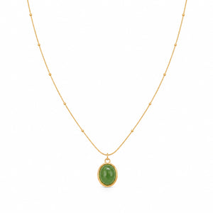 Angled view of the gold green cabochon bead necklace