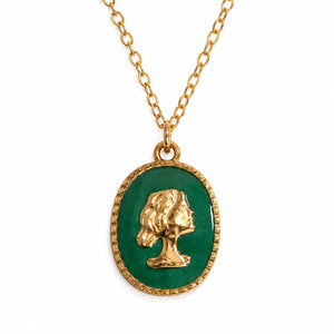 Gold green cameo layered necklace on a dark jewellery studio display