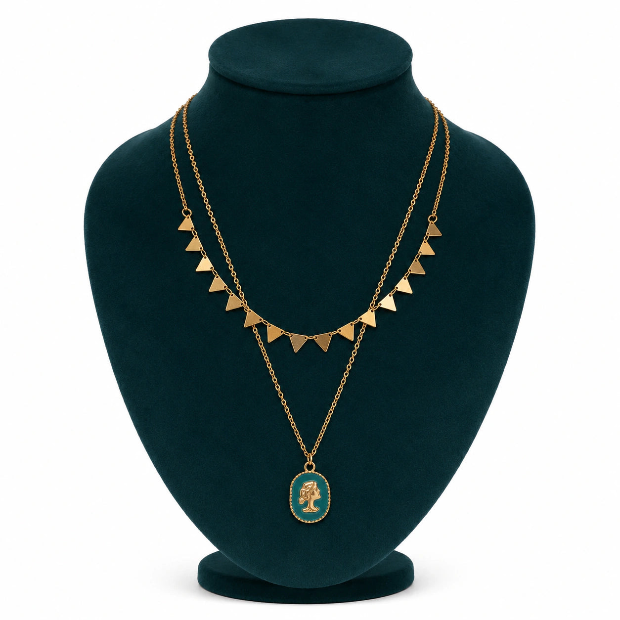 Gold green cameo necklace styled in an elegant jewellery flat lay