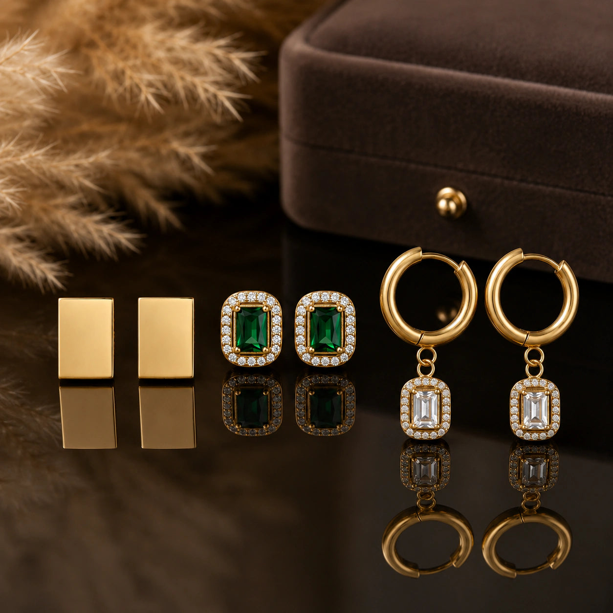 Gold green halo earring set styled in an elegant jewellery flat lay