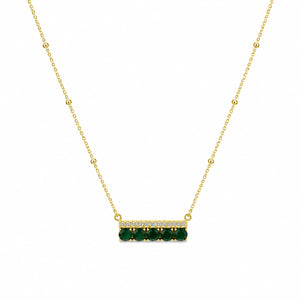 Close-up of the green stone and crystal-bar pendant detailing