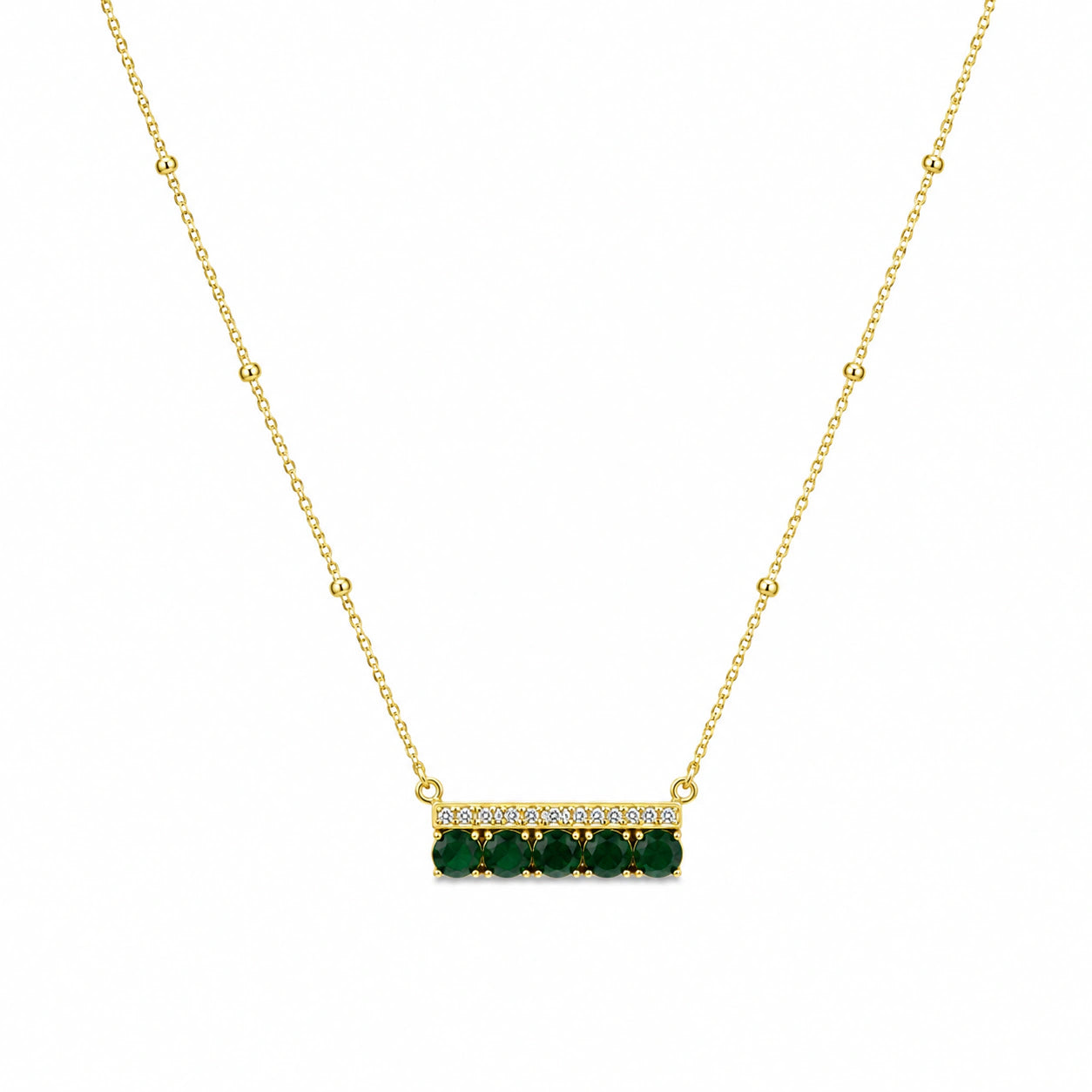 Close-up of the green stone and crystal-bar pendant detailing