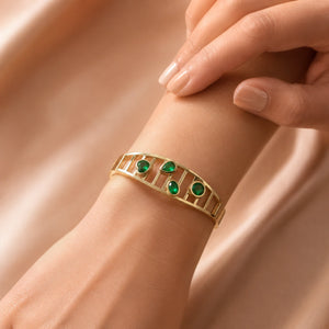 Alternate product view of the gold green stone openwork kada