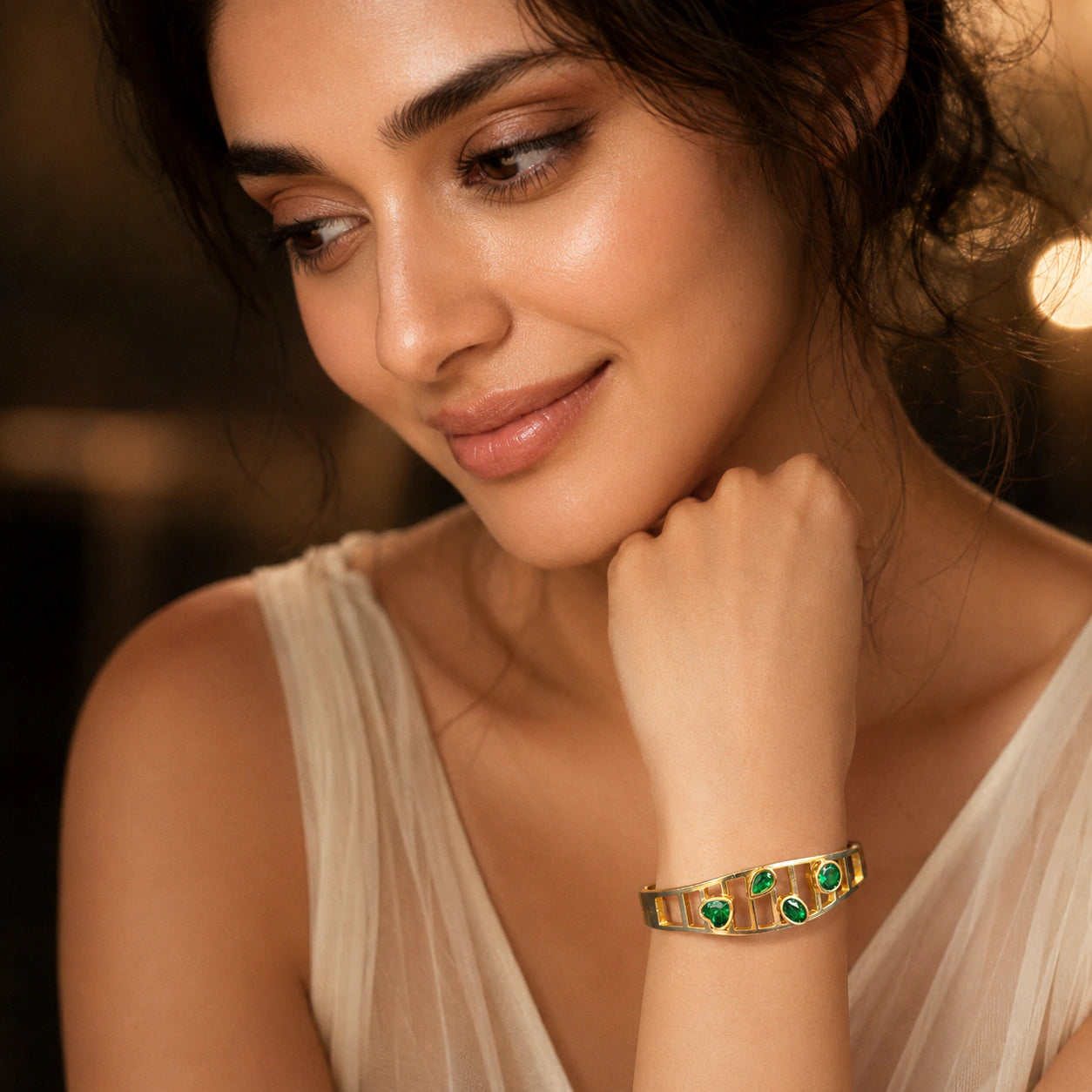 Side view of the gold green stone openwork kada