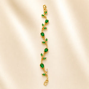 Angled view of the gold green tulip-vine bracelet