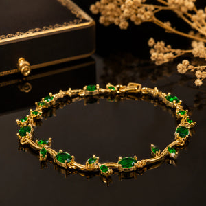 Side view of the gold green tulip-vine bracelet