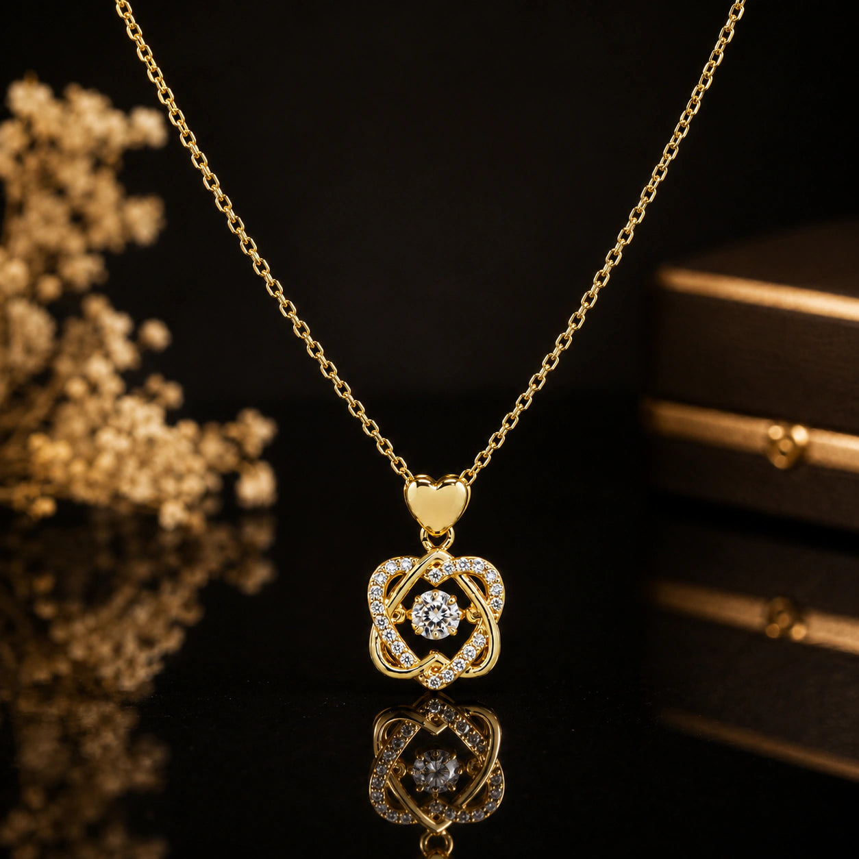 Alternate detail view of the gold heart-bail crystal knot pendant