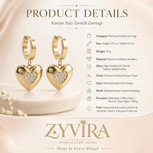 Product details card for gold heart charm huggie hoop earrings