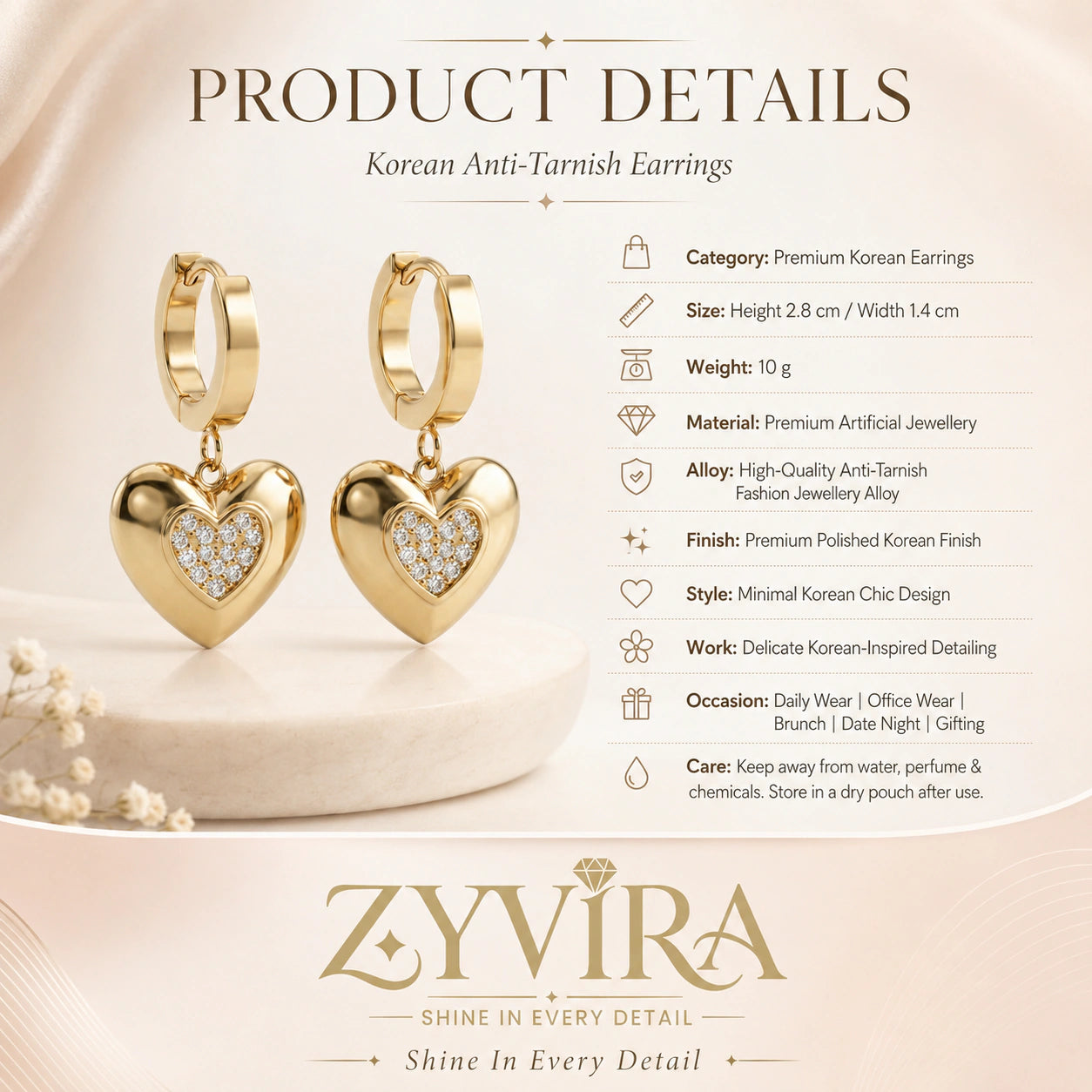 Product details card for gold heart charm huggie hoop earrings