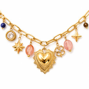 Gold-tone heart charm necklace with pink bead accents