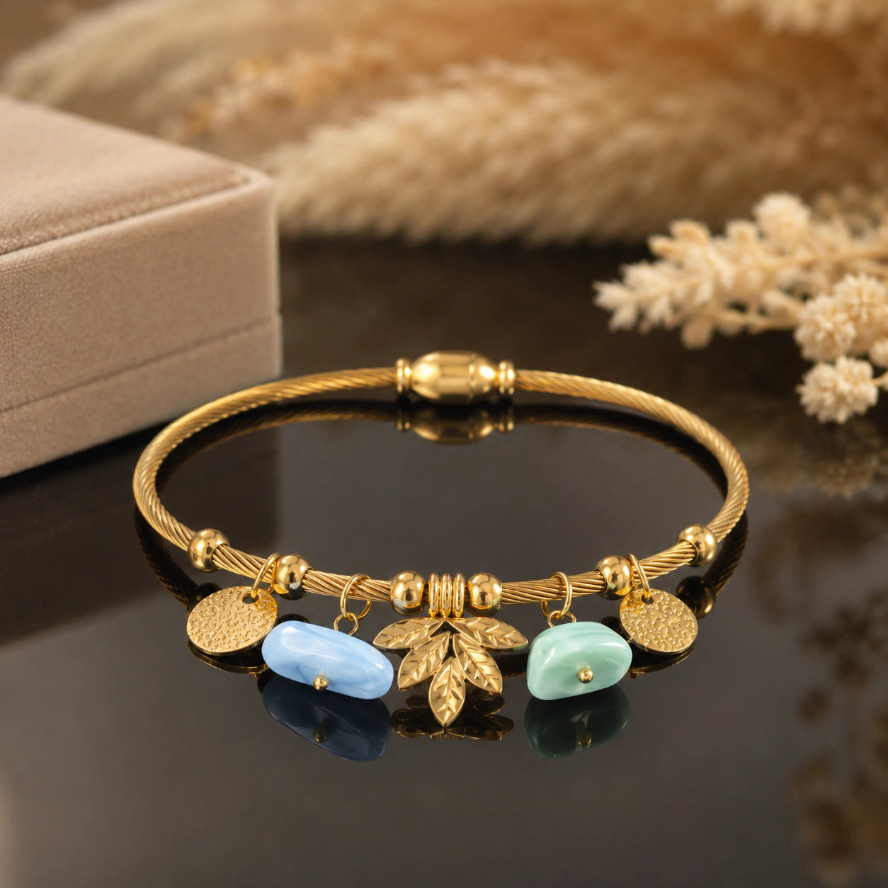Close-up of leaf motifs and pastel charm detailing