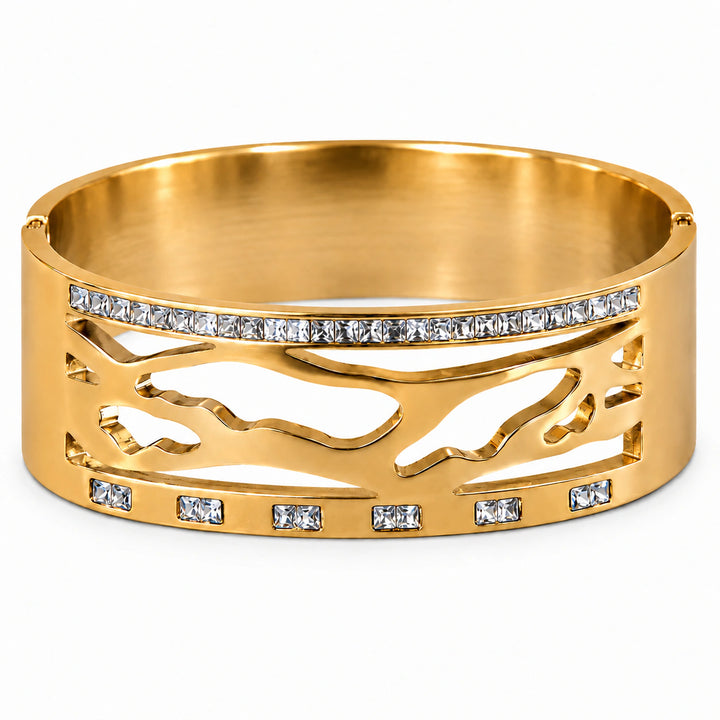 Gold marquise crystal bar kada on a dark jewellery studio display