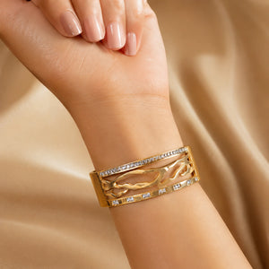 Gold marquise crystal kada styled in an elegant jewellery flat lay