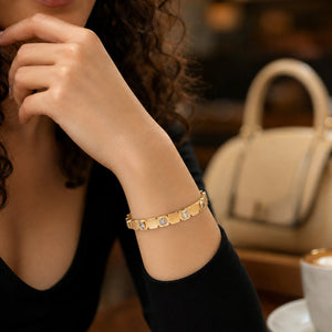 Gold mixed-cut crystal link bracelet on a dark jewellery studio display