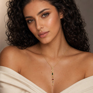 Gold multigem Y necklace styled in an elegant jewellery flat lay