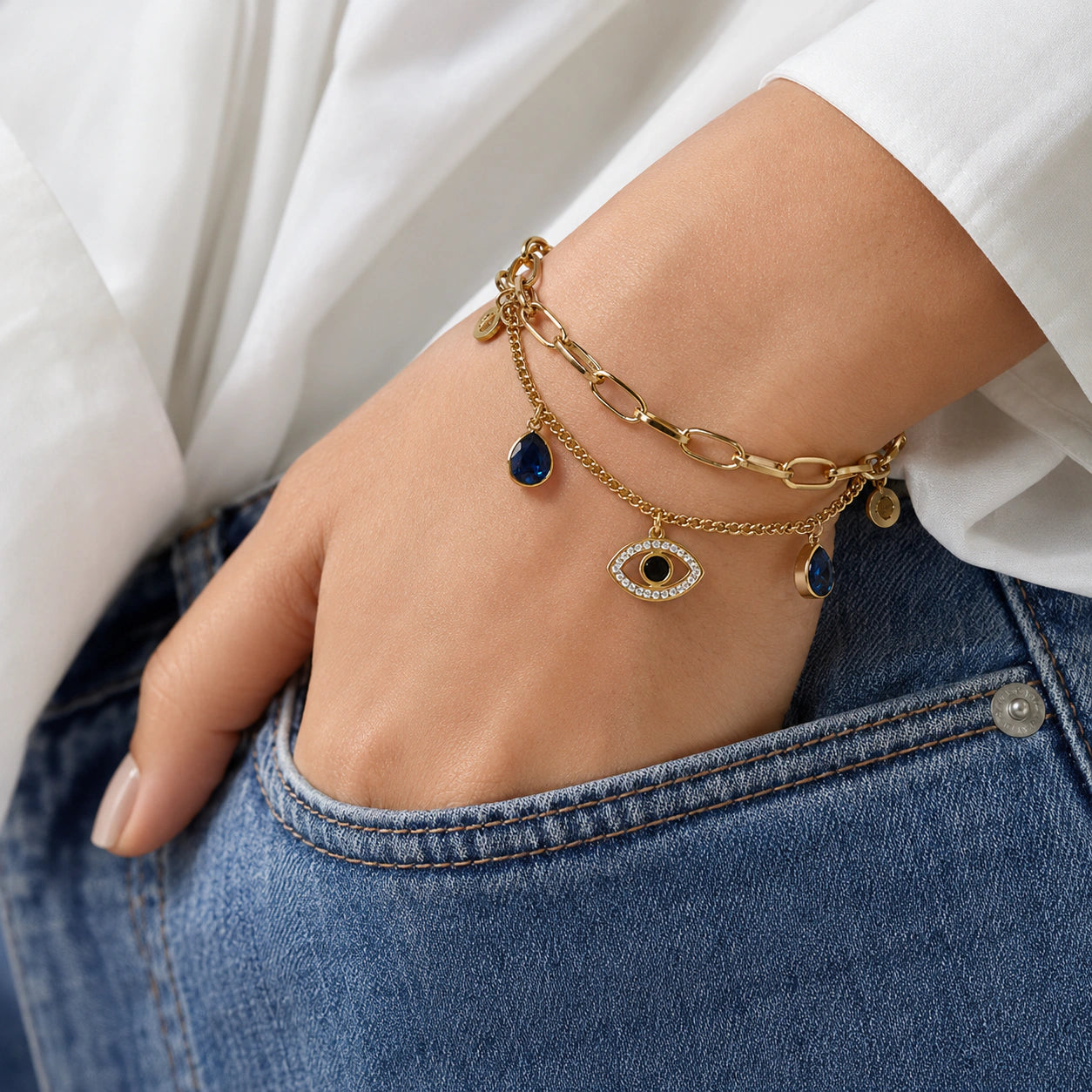 Angled view of the gold navy blue evil-eye bracelet