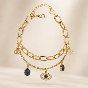 Side view of the gold navy blue evil-eye charm bracelet