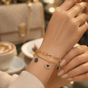 Top view of the gold navy blue evil-eye bracelet