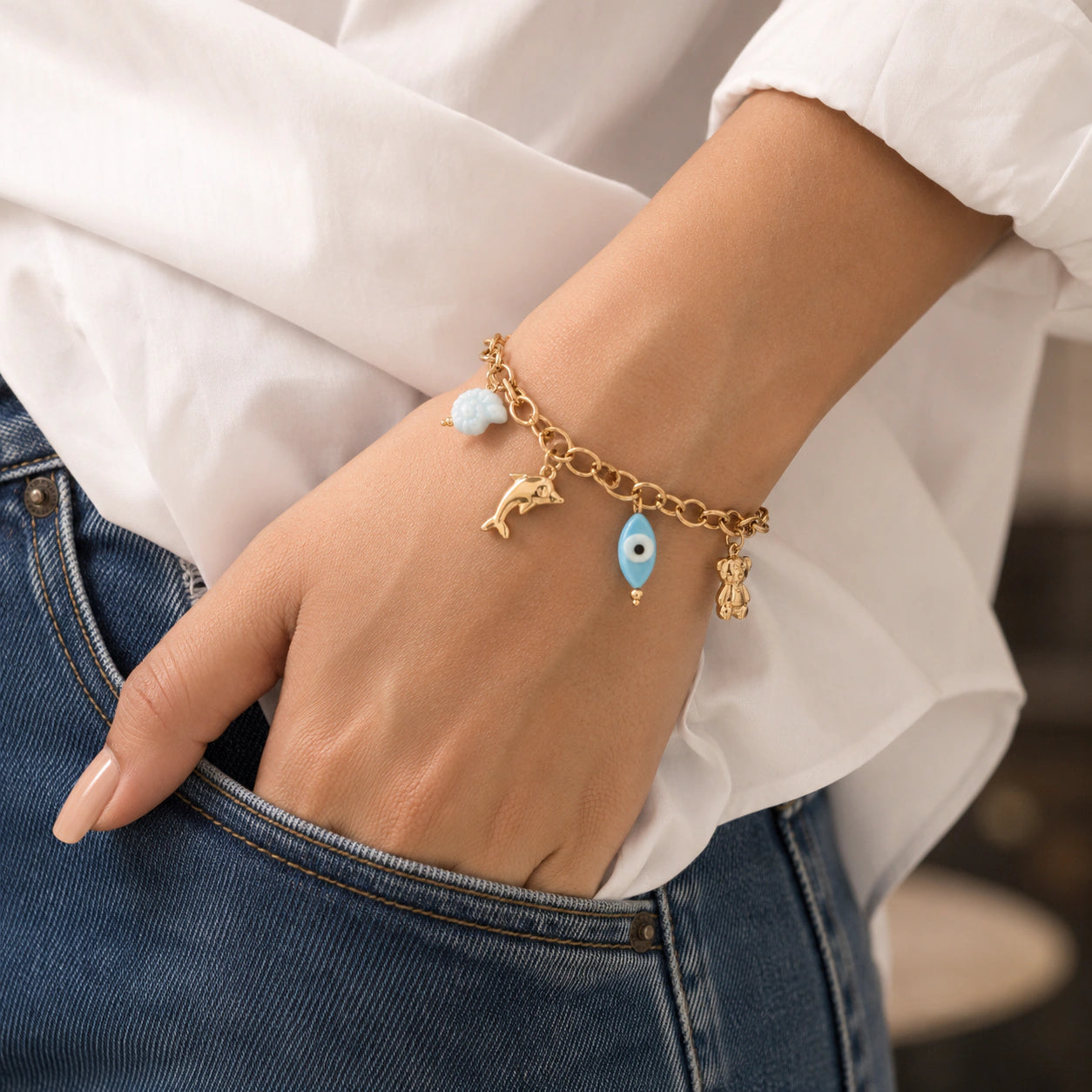 Alternate detail view of the gold ocean charm bracelet
