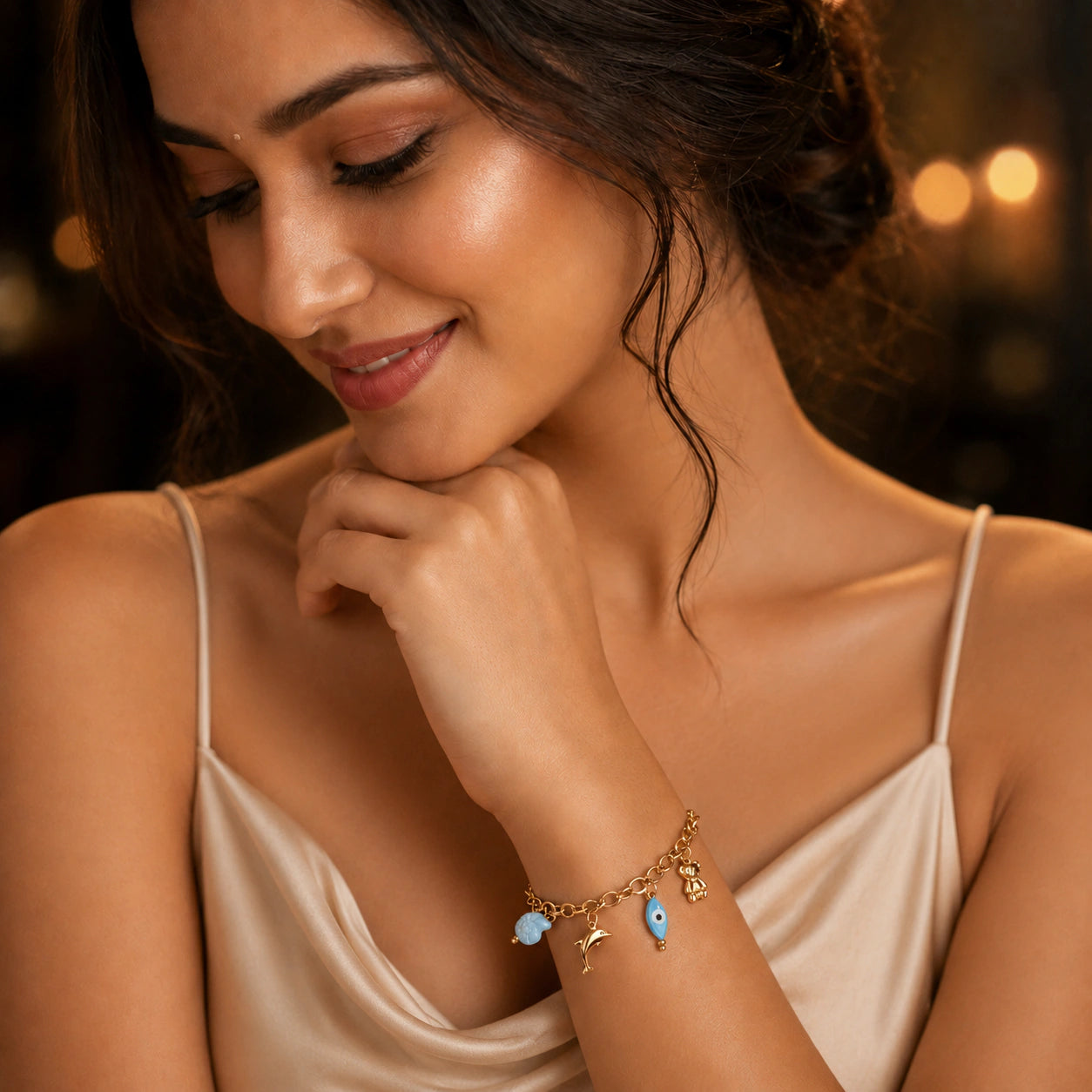 Open link view of the gold ocean charm bracelet