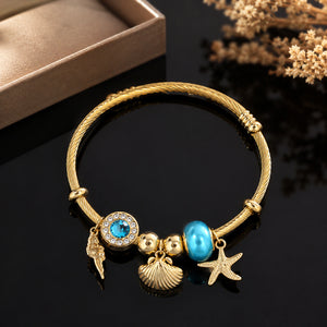 Alternate product view of the gold ocean charm kada bracelet