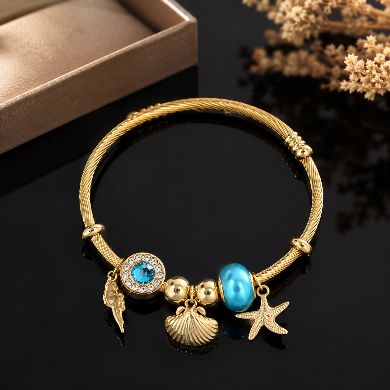 Alternate product view of the gold ocean charm kada bracelet
