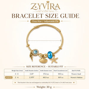 Gold ocean charm kada styled in a beach-inspired jewellery flat lay