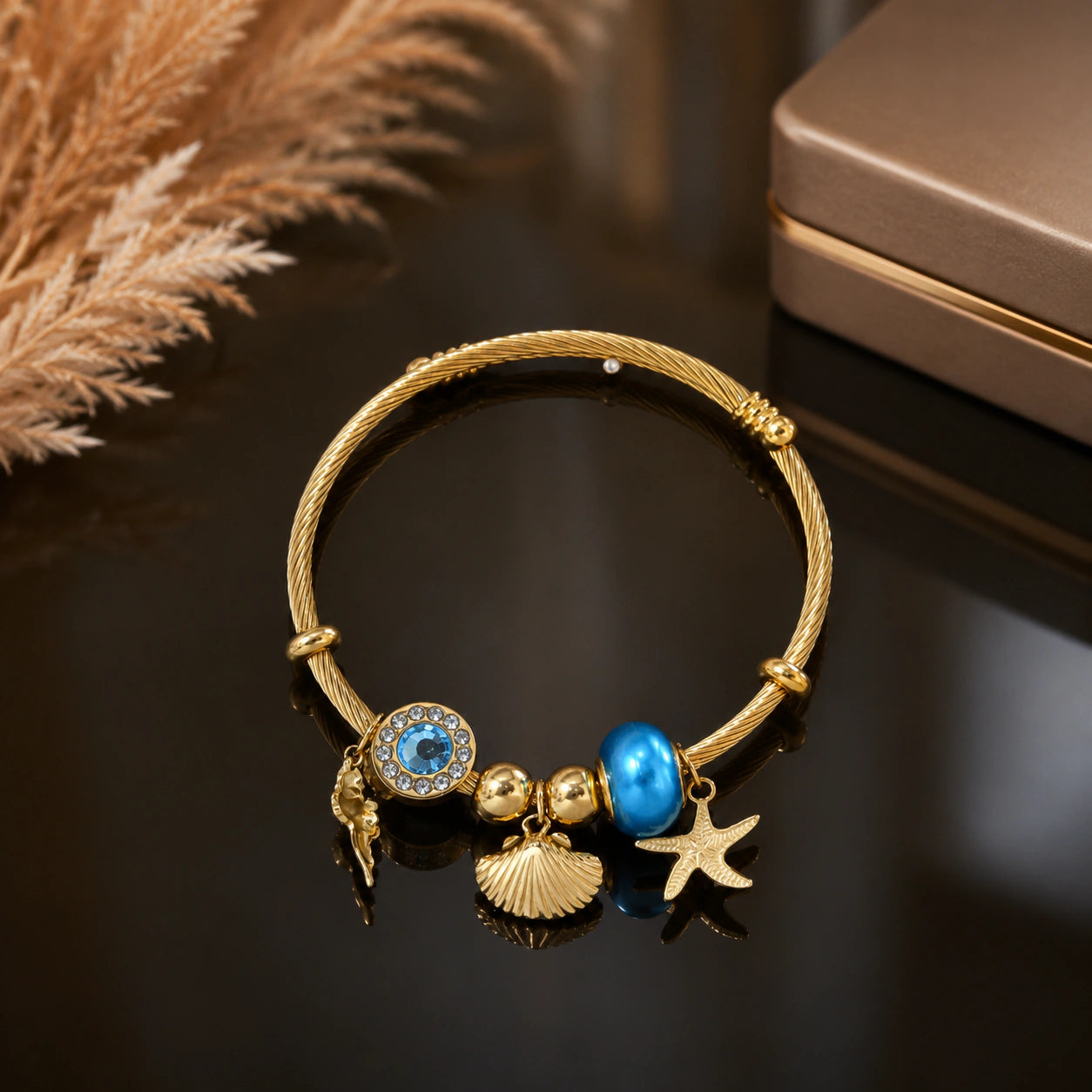 Gold-tone ocean charm twisted cable kada bracelet