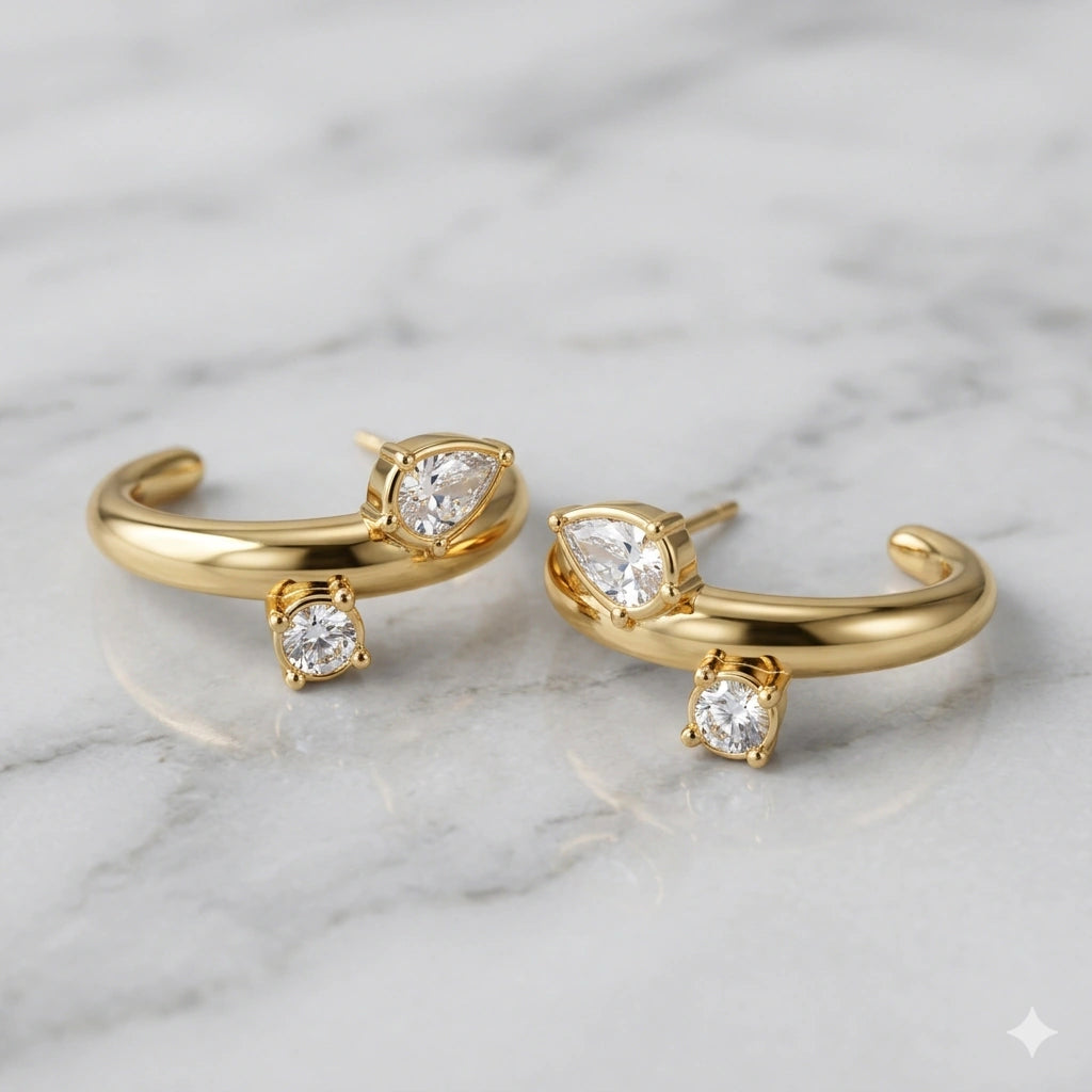Side view of gold crystal-style open cuff hoop earrings