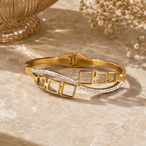 Close-up of open-square crystals and hinged kada detailing