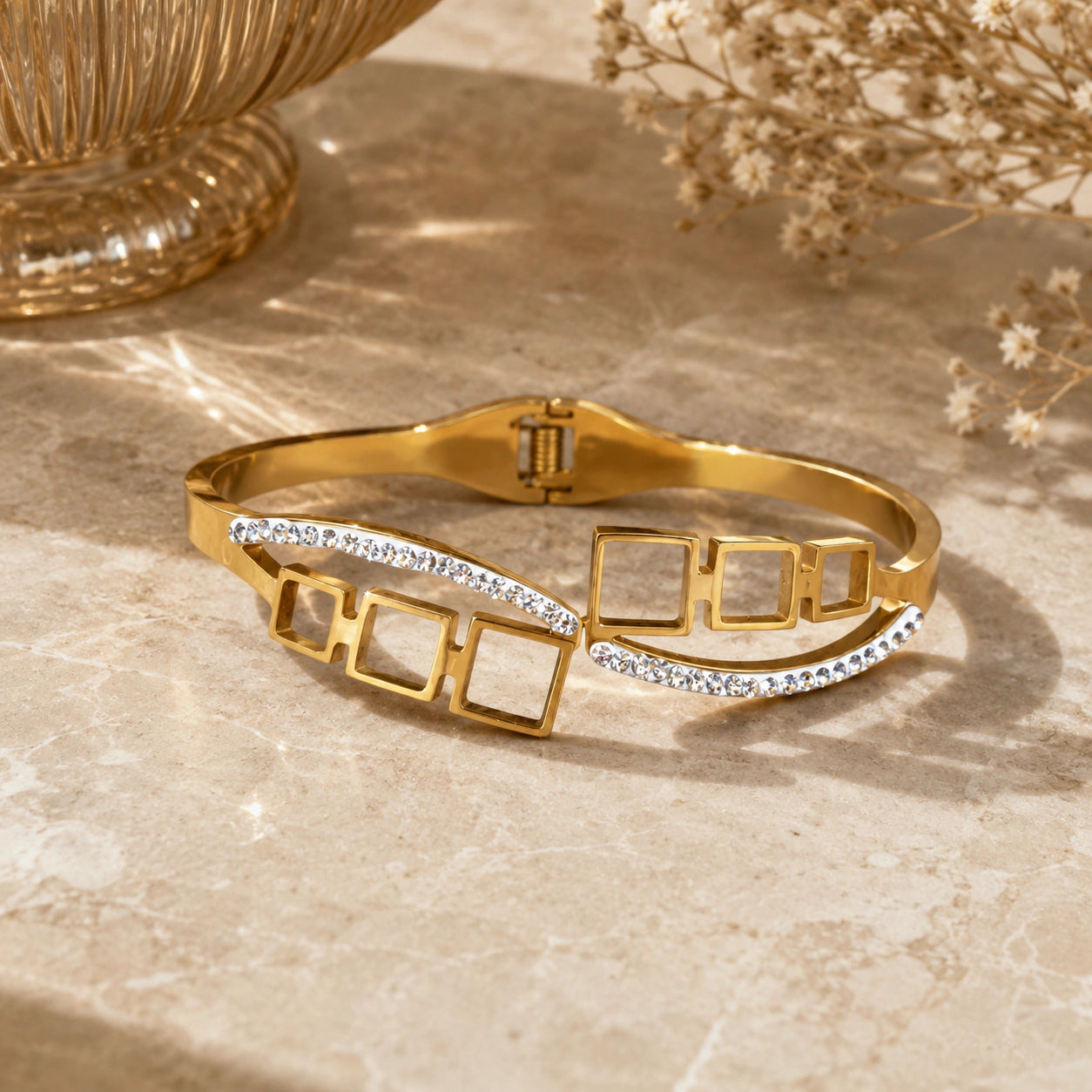 Close-up of open-square crystals and hinged kada detailing