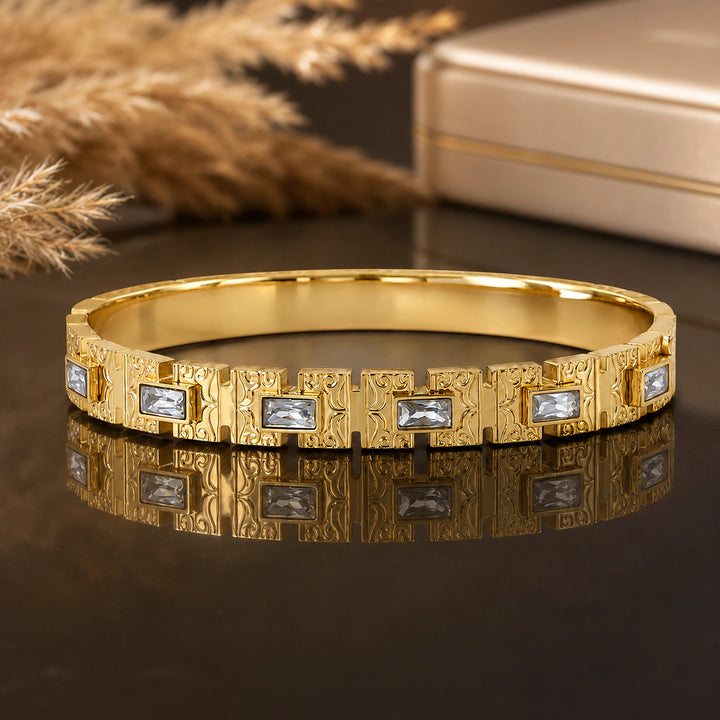 Gold-tone openwork crystal-style rigid kada bracelet