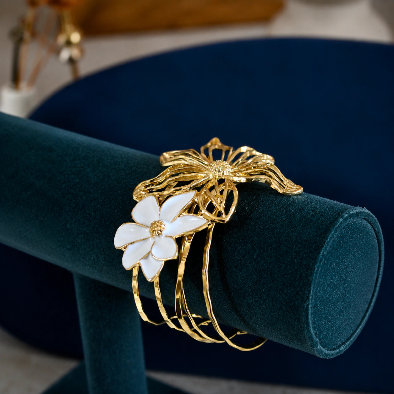 Angled view of the gold openwork floral multi-band kada