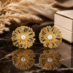 Gold openwork sunburst pearl-style statement stud earrings