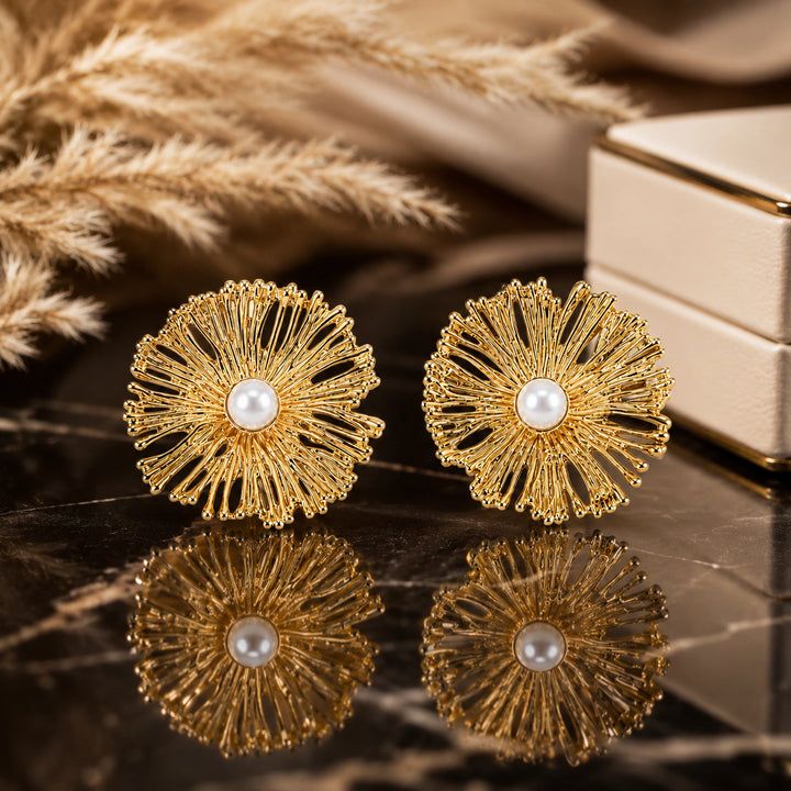Gold openwork sunburst pearl-style statement stud earrings
