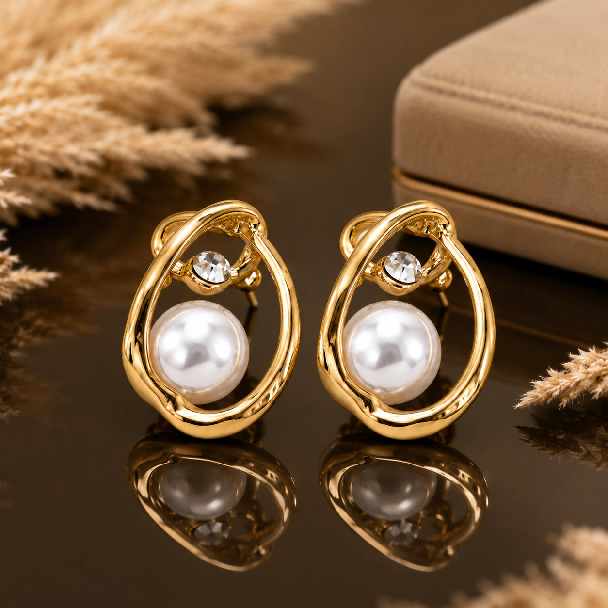 Gold-tone organic teardrop pearl-style crystal stud earrings