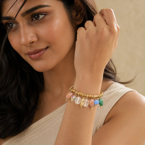 Side view of the gold pastel bead leaf charm bracelet