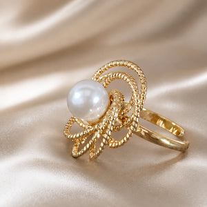 Angled view of the gold pearl beaded loop ring